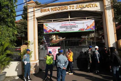 Multiple explosions shake a mosque in an Indonesian high school, injuring dozens